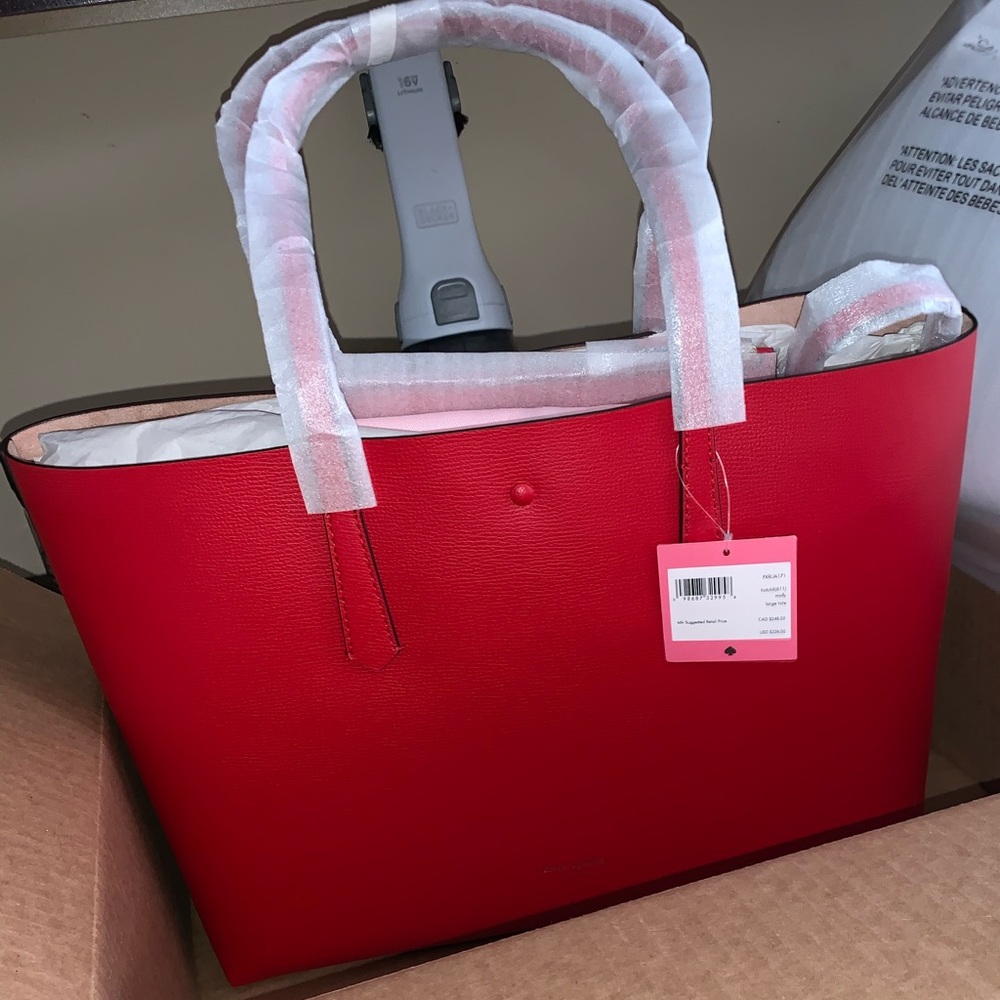 kate spade large “Molly” tote in chili.  Brand new